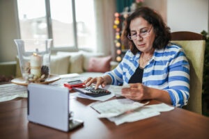 woman looking at her debt bills