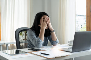 Woman stressed from Debt