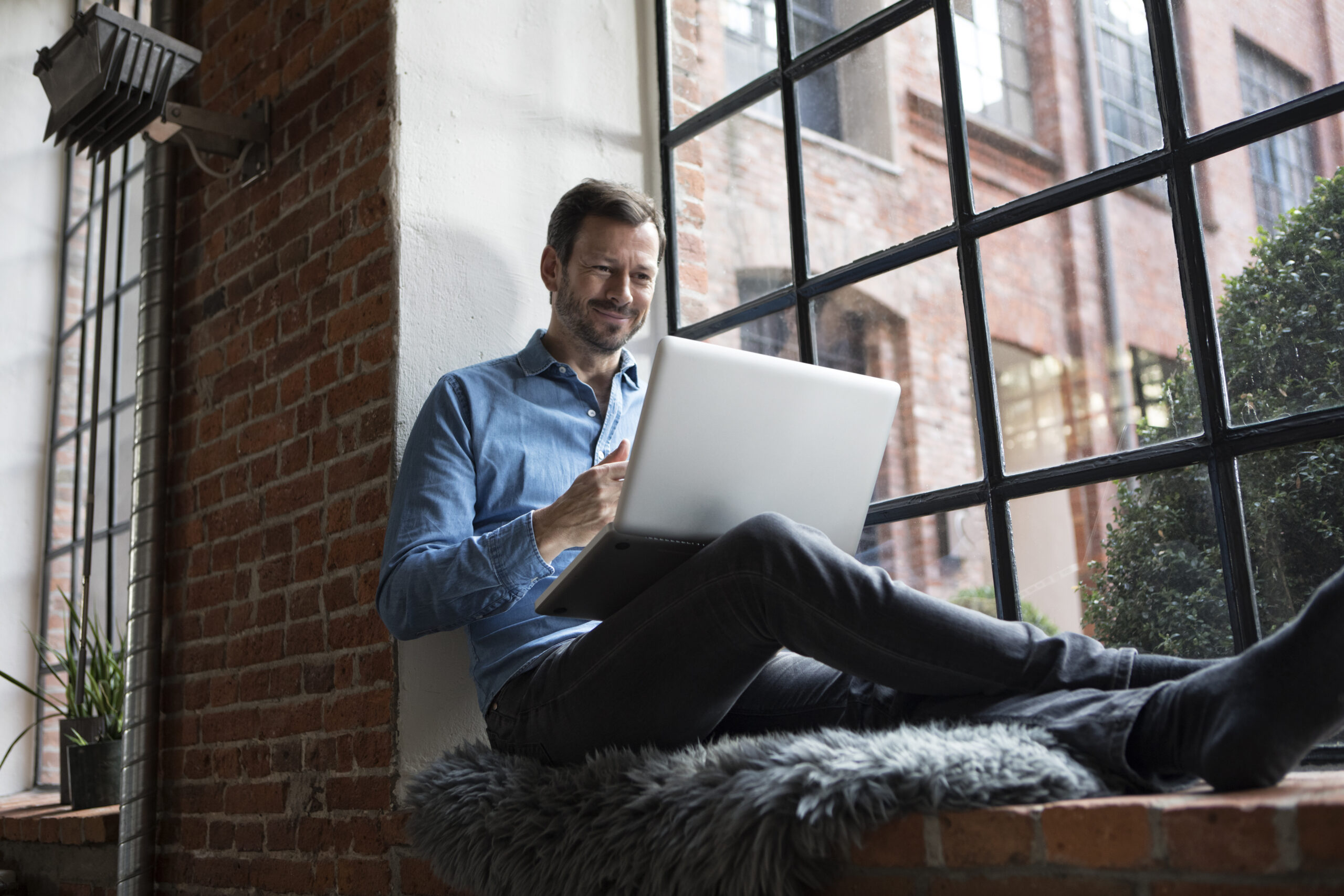man creating budget with 50/30/20 Rule